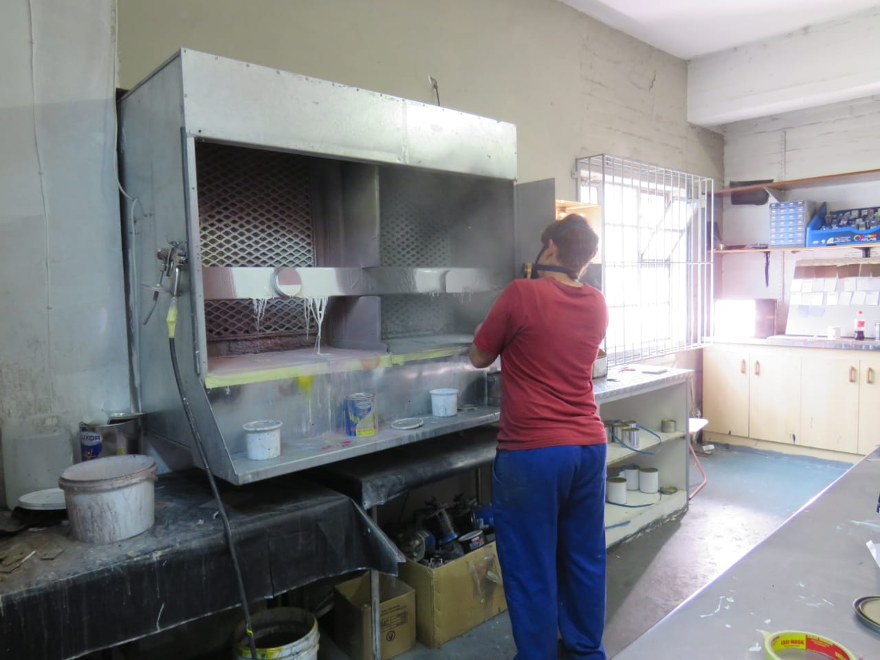 Staff at paint mixing station